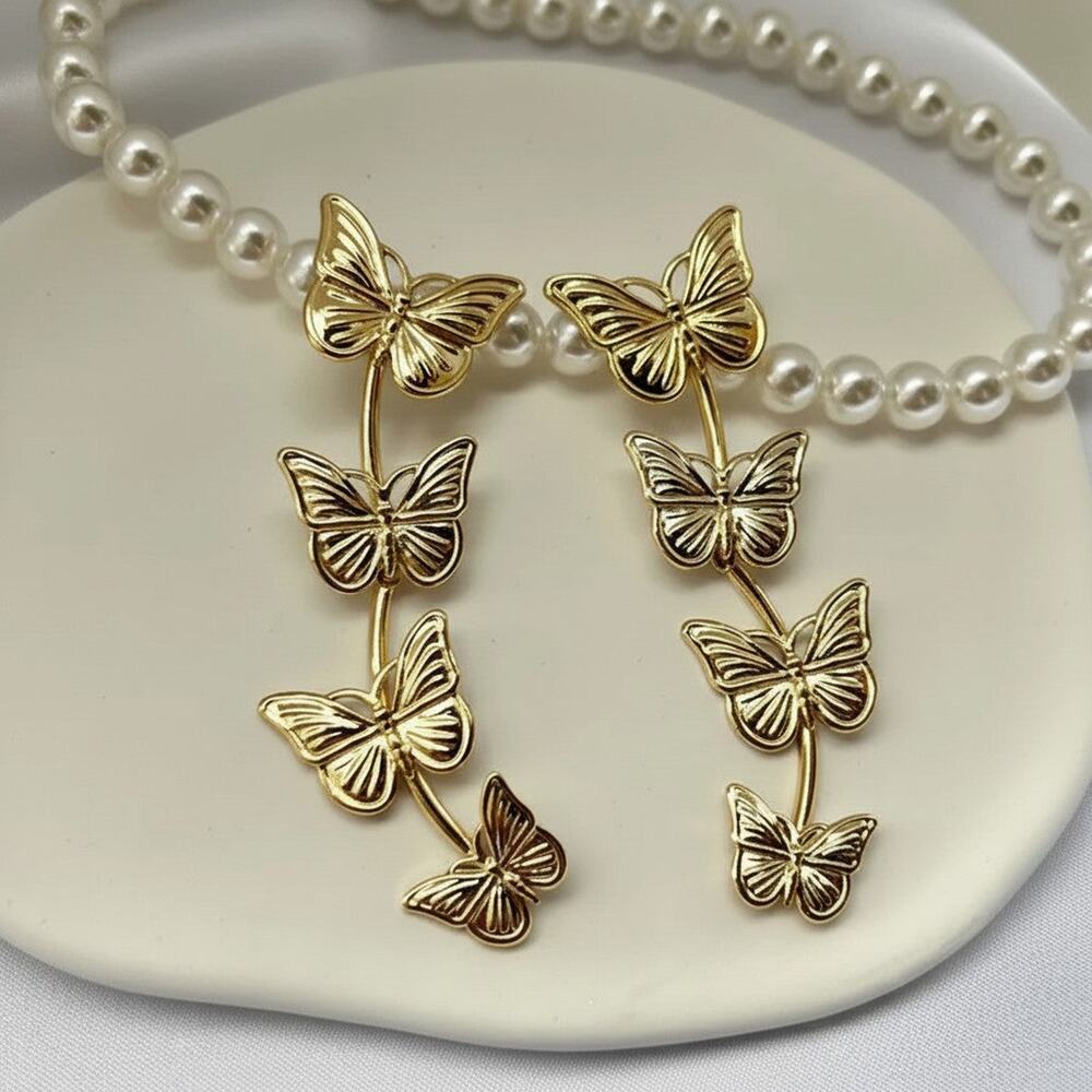 Pierced 3" gold butterfly dangle earrings